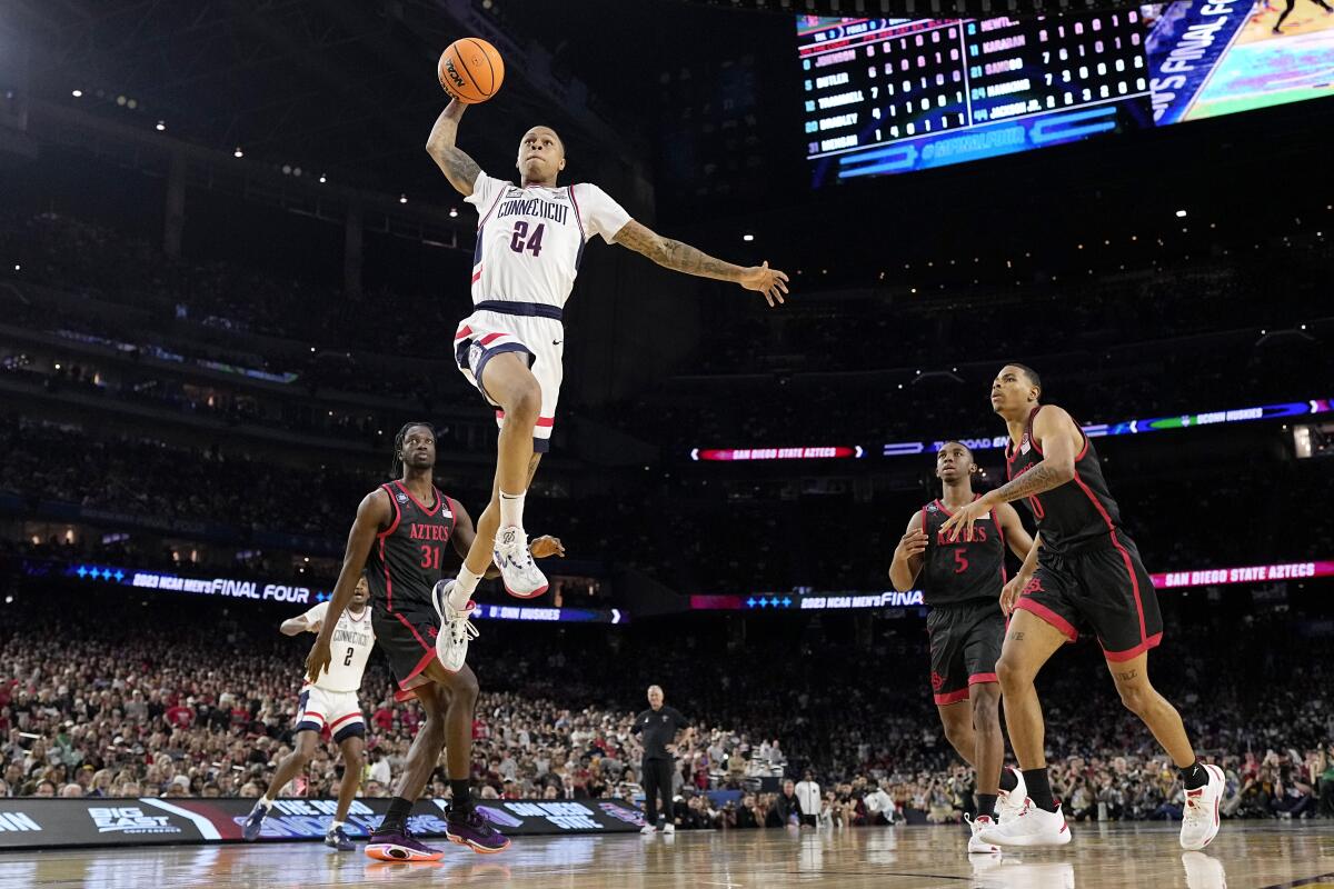 Basketball player finishing at the rim
